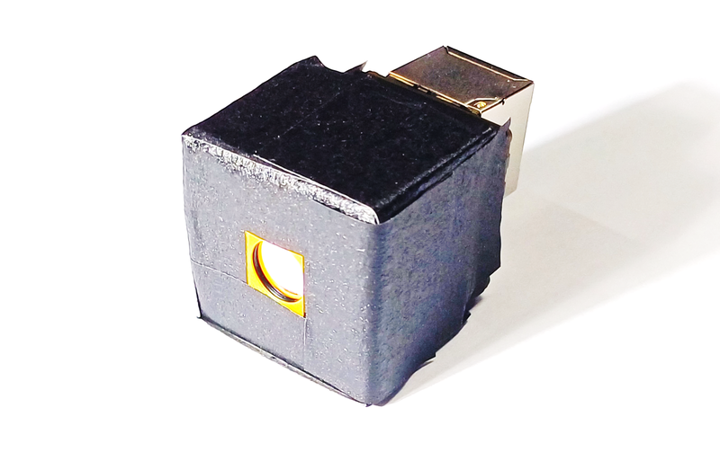 The fabricated compact camera, including the camera body and rear module